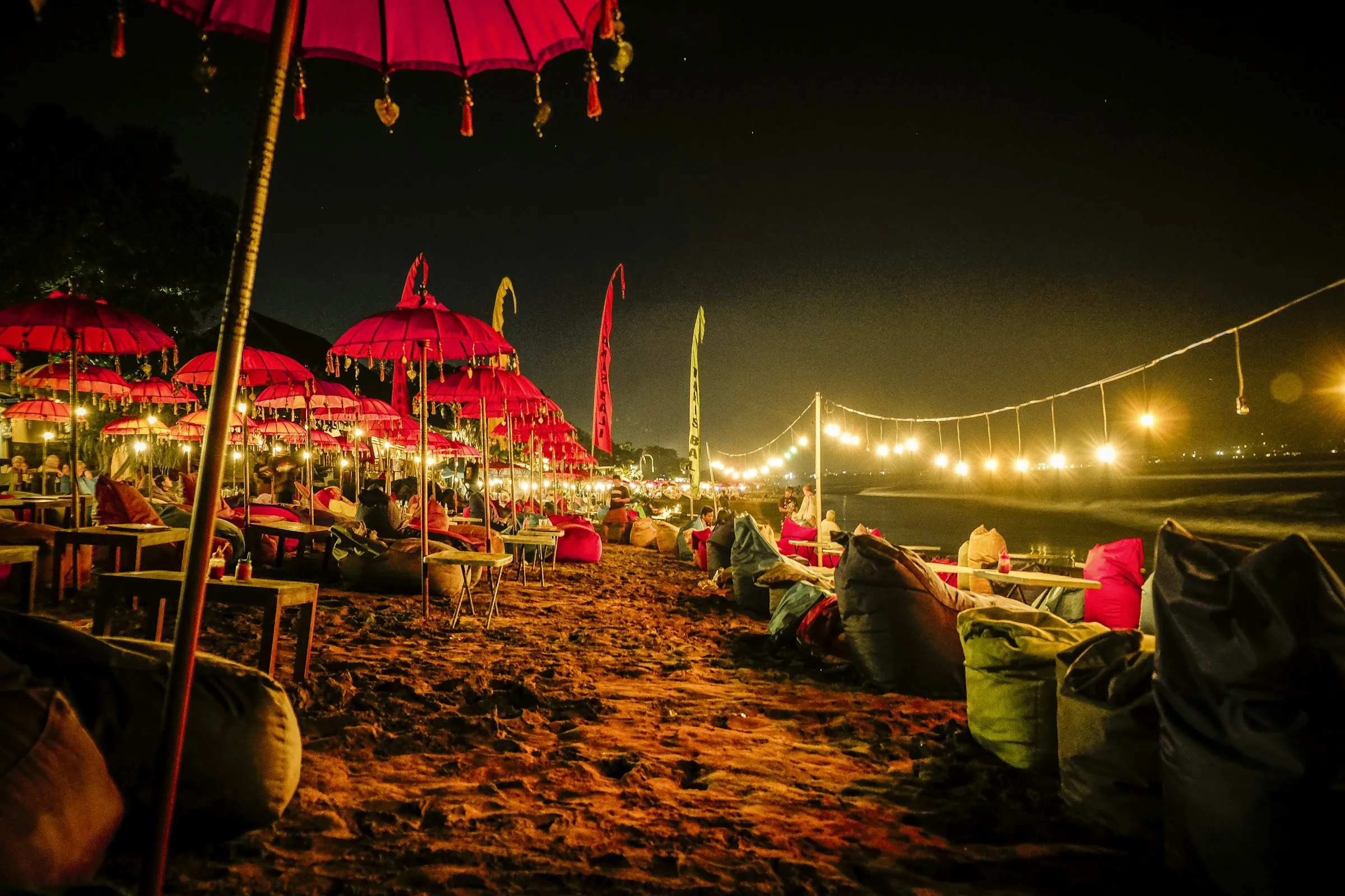 Dinner on a Bali beach under Balinese umbrellas